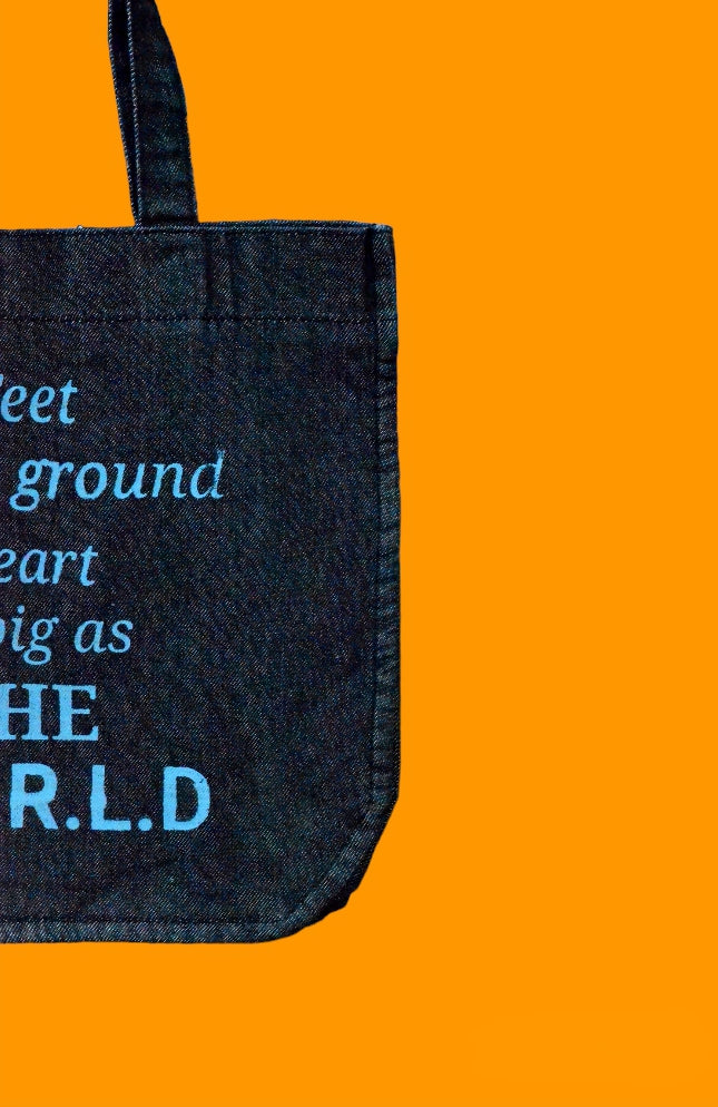 "Feet on the ground heart as big as the world" Black Denim Tote Bag
