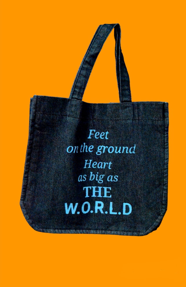 "Feet on the ground heart as big as the world" Black Denim Tote Bag