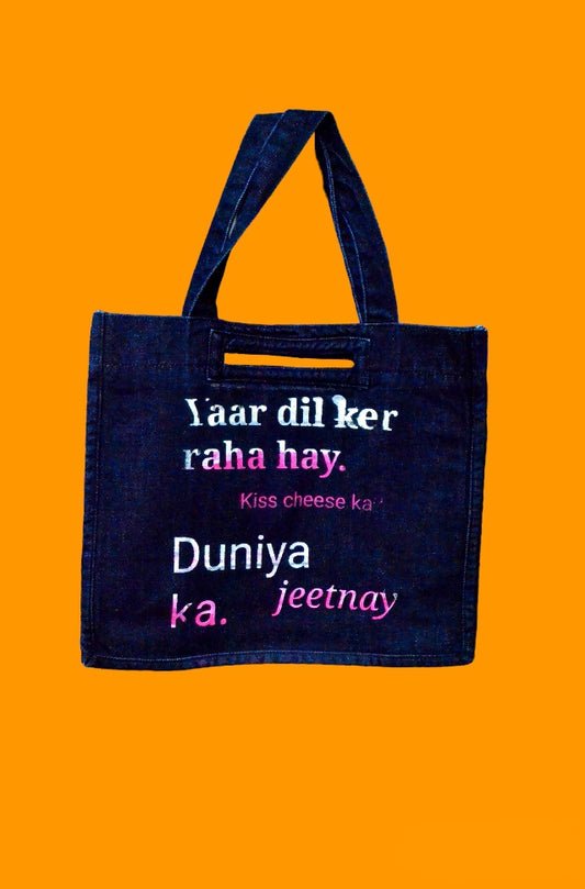 "Yaar Dil Kar Raha Hay. Kiss Cheese Ka? Duniya Jeetnay ka." Dark Blue Denim Tote Bag