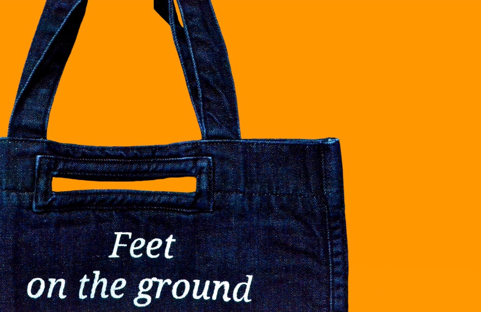 "Feet on the ground heart as big as the world " Dark Blue Denim Tote Bag