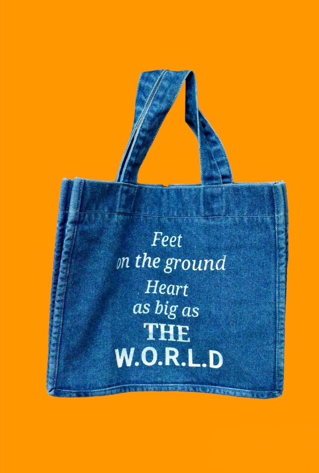 "Feet on the ground, Heart as big as the world" Light Blue Denim Tote bag