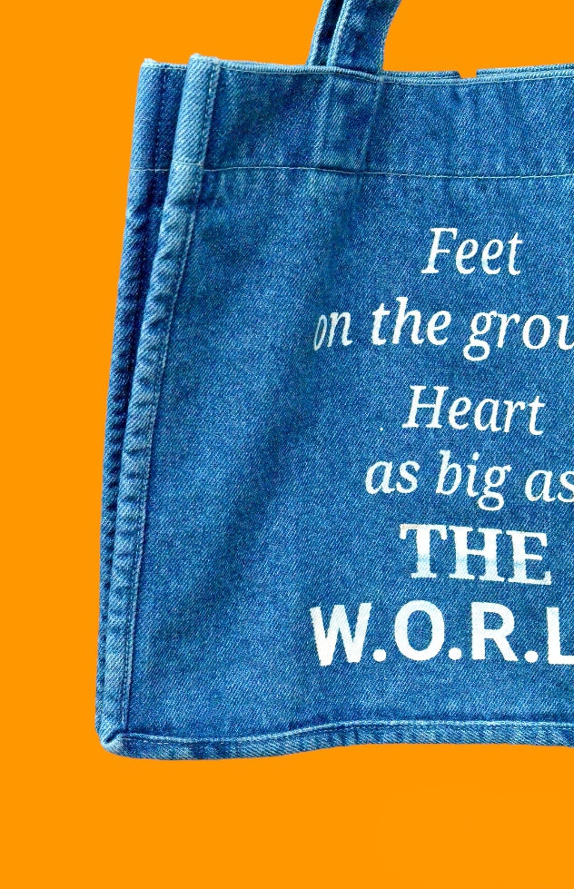 "Feet on the ground, Heart as big as the world" Light Blue Denim Tote bag