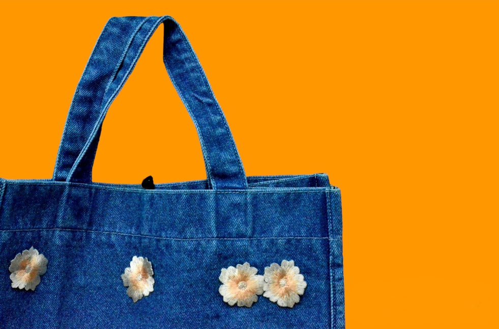 White embroidery blue denim tote bag details