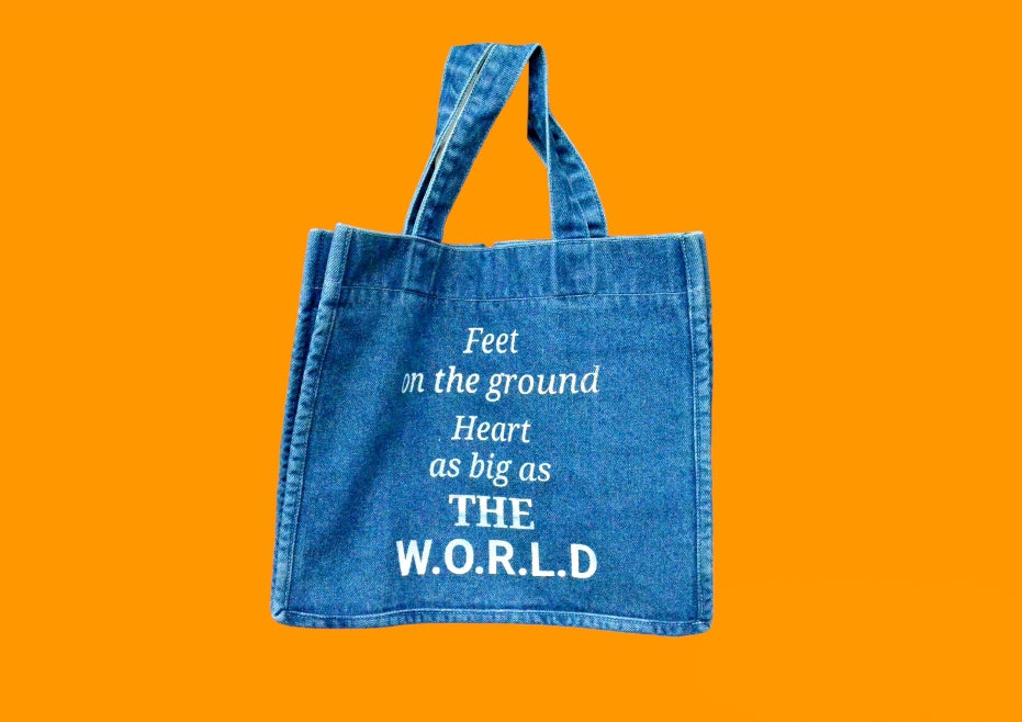 "Feet on the ground, Heart as big as the world" Light Blue Denim Tote bag